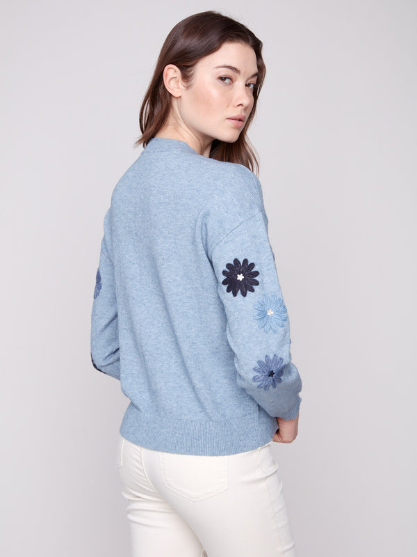 Heather denim sweater with elegant floral patterns, designed in a cozy relaxed fit by Charlie B.