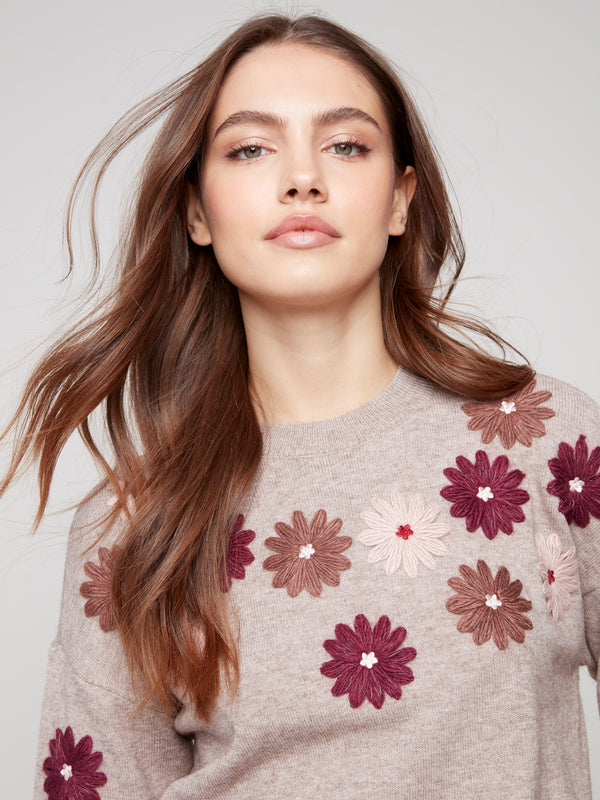Taupe sweater with elegant floral embroidery, featuring drop shoulders and ribbed detailing by Charlie B.