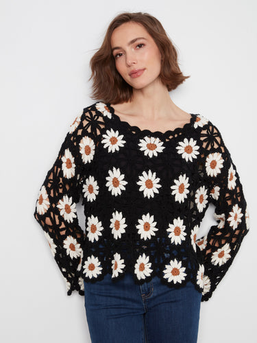 This sweater features a boat neckline, showcasing its unique style and elegance. Perfect for any occasion by Charlie B.