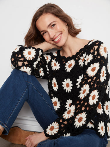 Long sleeves provide warmth and style in this beautifully crafted crochet sweater, ideal for cooler days by Charlie B.