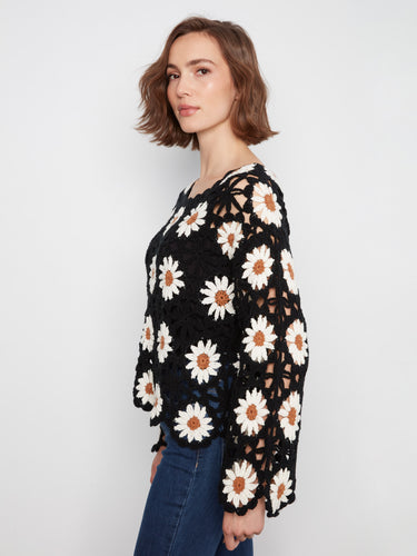 Adorned with a boat neckline, this stunning sweater combines comfort and fashion effortlessly by Charlie B.