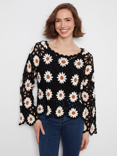 Handcrafted with care, the intricate crochet design of this sweater is both eye-catching and elegant by Charlie B.
