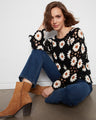 Stay cozy in long sleeves while embracing the detailed craftsmanship of this beautiful crochet creation by Charlie B.