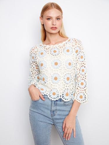 Beautifully crafted crochet sweater with a sophisticated boat neckline, ideal for casual or dressy occasions by Charlie B.