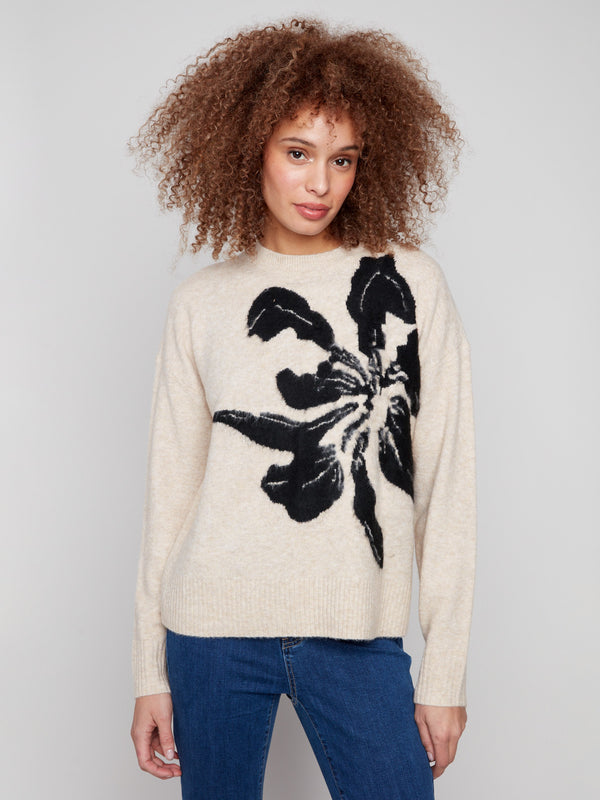 Beige sweater featuring a crew neck and bold abstract flower jacquard, perfect for cozy elegance by Charlie B.