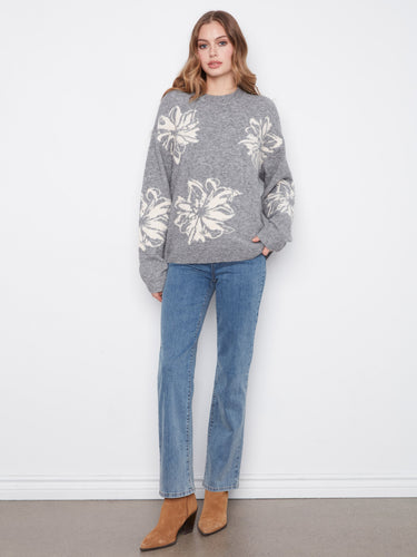 This sweater showcases drop shoulders, creating a relaxed silhouette perfect for casual outings by Charlie B.