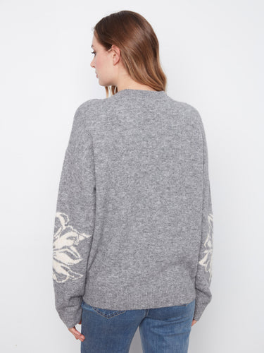 Ribbed cuffs and hem provide a snug fit, enhancing the overall appeal of this stylish sweater by Charlie B.