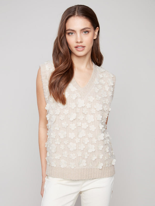 Sophisticated sleeveless style adds versatility to this floral mesh V-neck sweater vest by Charlie B.