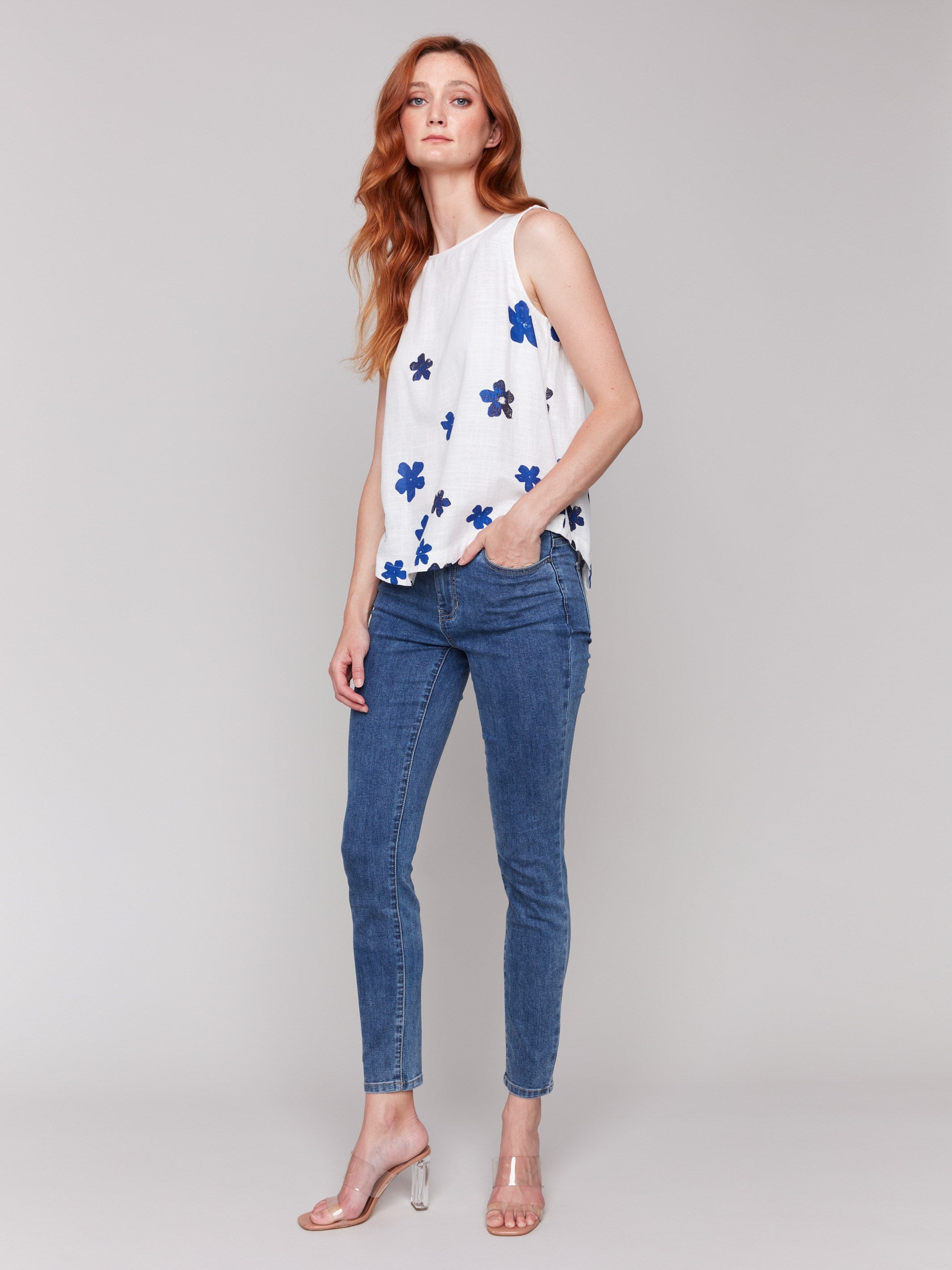 Crew neckline and rounded hem in a floral pattern by Charlie B.