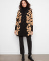 Chic coat with a tailored collar, featuring intricate sherpa floral motifs for an elegant touch. By Charlie B.