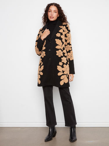 This sophisticated coat features a tailored collar and exquisite sherpa floral details for added elegance. By Charlie B.
