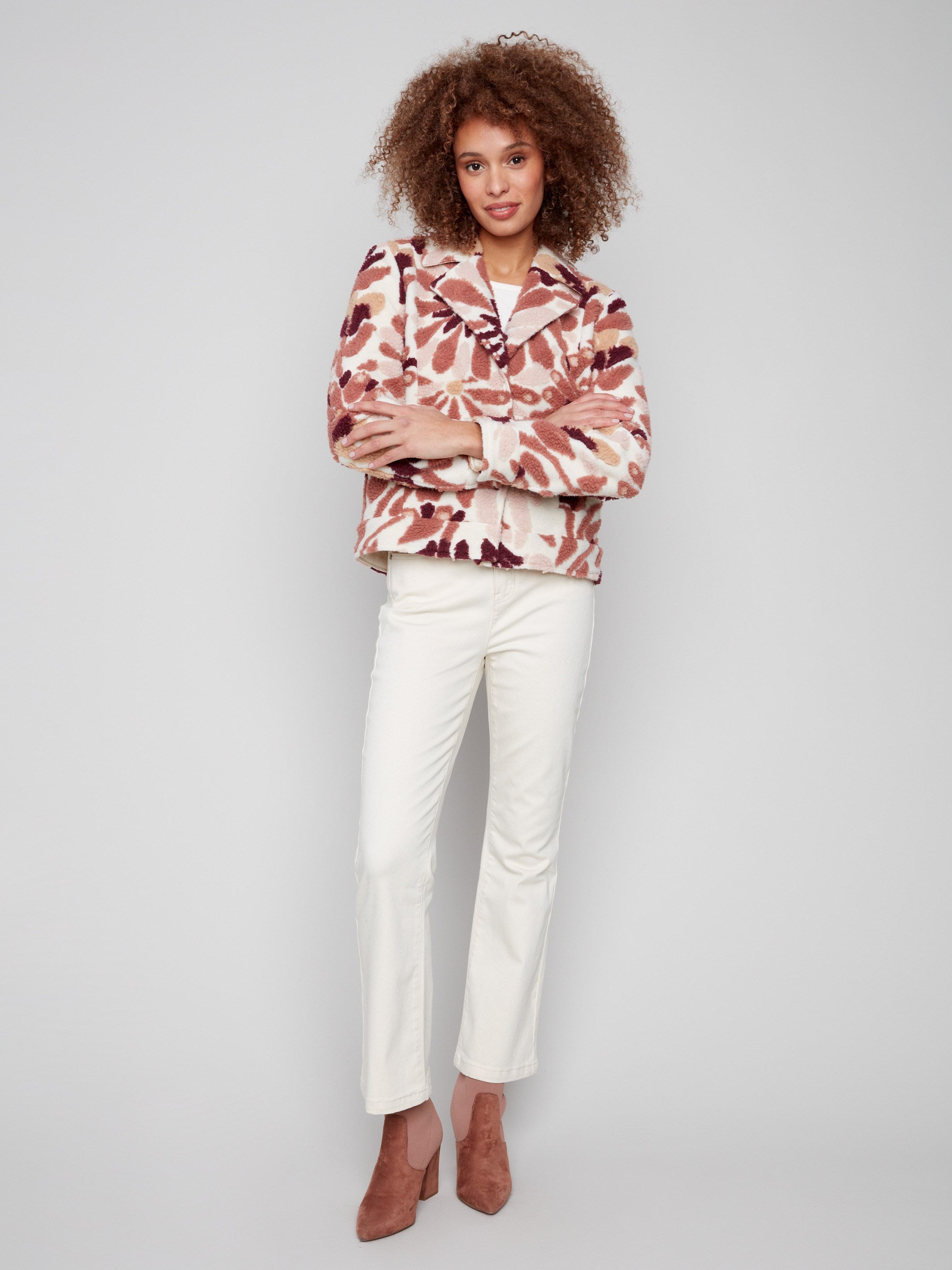 Floral sherpa fleece coat featuring front snap closure for an elegant yet practical touch by Charlie B.