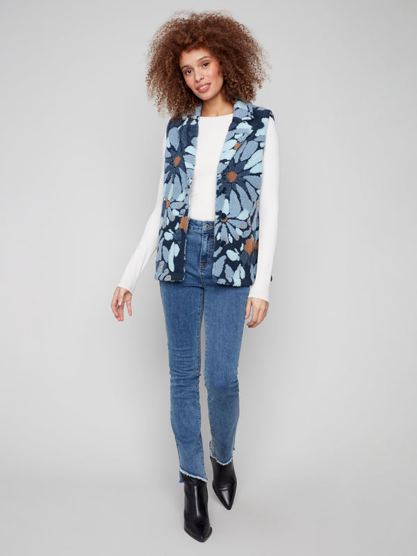Blue floral vest with cozy Sherpa fleece, featuring a stylish spread collar for added elegance by Charlie B.