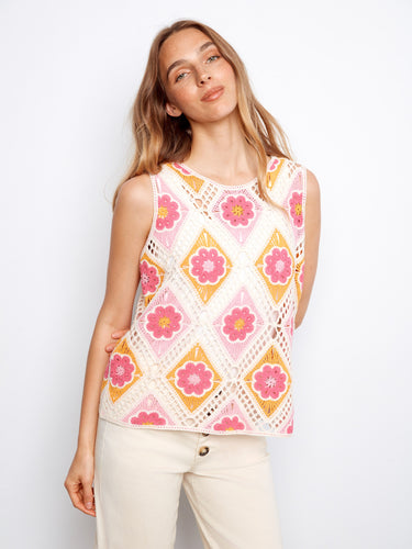 Experience elegance with this floral-patterned top featuring an airy sleeveless design, perfect for summer vibes. By Charlie B.