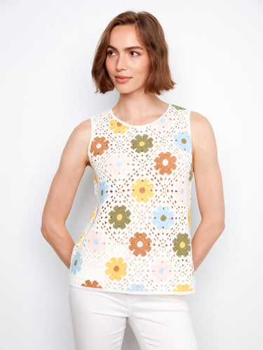 Embrace the sleeveless design of this top, offering comfort and freedom of movement while showcasing its bold floral print by Charlie B.