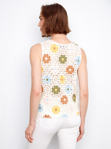 The intricate floral pattern on this top creates a lively look, ideal for adding a splash of color to your wardrobe essentials by Charlie B.