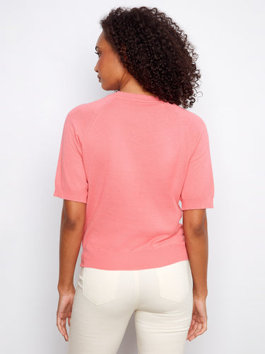 Stylish pink top with intricate applique embroidery on soft 100% cotton material, perfect for any occasion. By Charlie B.