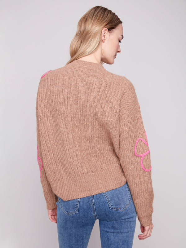 Elegant drop shoulder sweater in Heather Truffle with unique pink detailing for added charm by Charlie B.