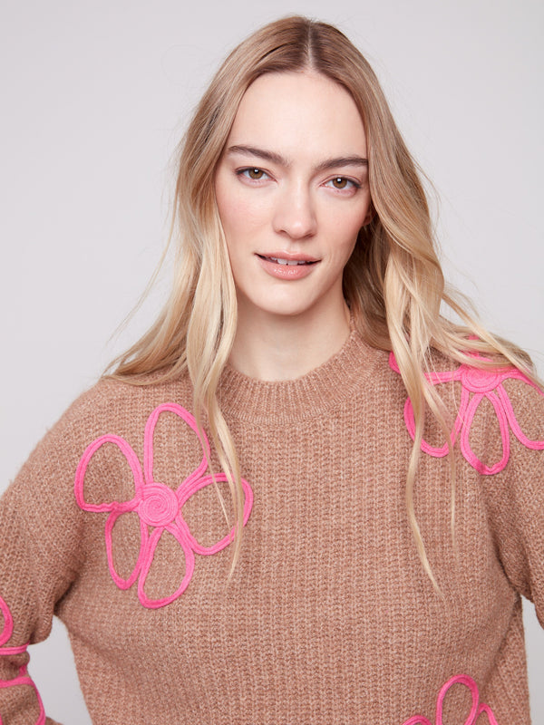 Crew neck style enhanced with playful contrast soutache detailing in pink florals by Charlie B.