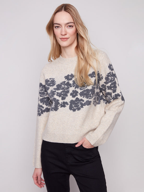 Heather vanilla sweater featuring a relaxed fit and floral jacquard design, perfect for cozy days by Charlie B.