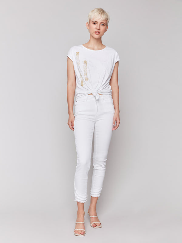 Chic white top featuring a trendy front knot detail by Charlie B.