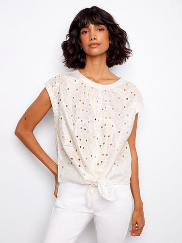 Gold foiled eyelet blouse with a stylish boat neckline, featuring a front hem tie for a chic look by Charlie B.