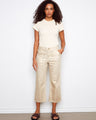 Cropped foiled twill pants with a regular rise and rectangular patch pockets, featuring snap button details by Charlie B.