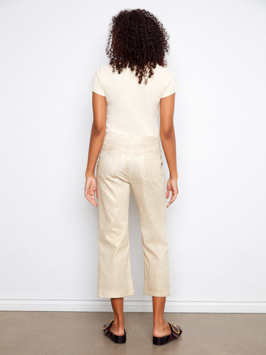 Snap button detail adds an edgy touch to these natural cropped twill pants with rectangular patch pockets by Charlie B.