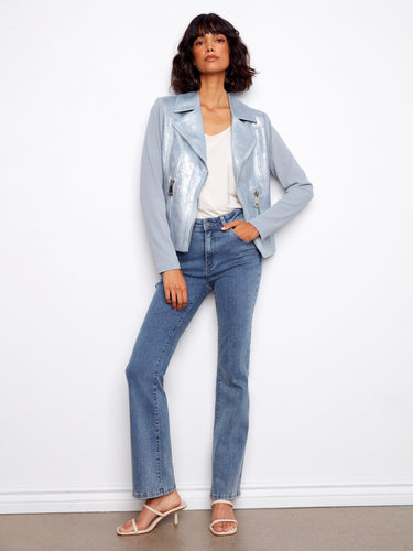 This light blue jacket features a unique hook-and-eye closure, adding elegance to its modern design by Charlie B.