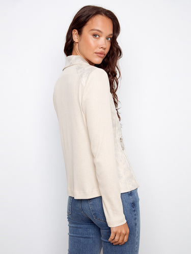 Adorned with zipper details, this jacket combines functionality with edgy style. By Charlie B.