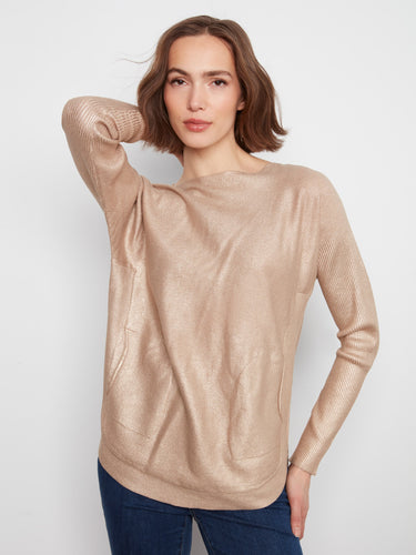 Chic top featuring a boat neck design, perfect for casual outings. Styled with front pockets for added convenience by Charlie B.