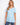 Light blue V-neck shirt with a relaxed fit and short sleeves, perfect for casual outings. By Charlie B.
