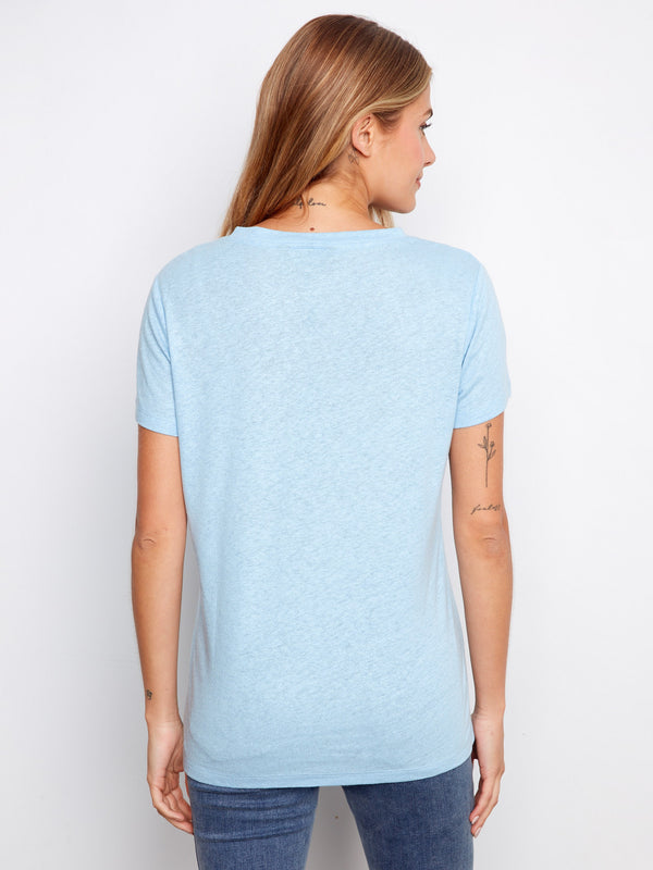 Soft light blue shirt with a relaxed fit, offering comfort and style in one versatile piece. By Charlie B.