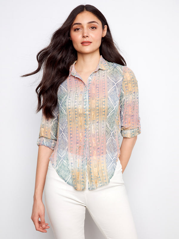 This shirt features a classic shirt collar, adding a touch of sophistication to the semi-sheer crinkle fabric design by Charlie B.