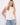 Elegant top featuring a scoop neckline, perfect for casual outings or dressing up. A versatile piece by Charlie B.