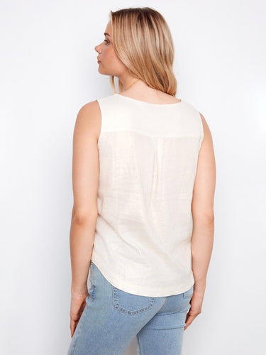 The high-low hem adds a modern touch to this classic top, making it a wardrobe essential by Charlie B.