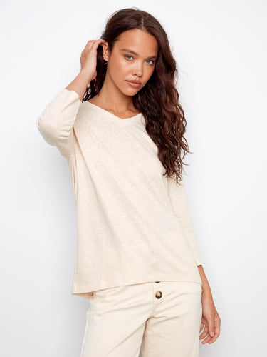 Chic relaxed fit top featuring a subtle foiled effect and comfortable 3/4 sleeves. Ideal for layering. By Charlie B.