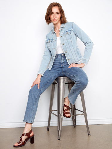 The button front detail on this light blue jacket adds a classic touch to its modern design. By Charlie B.