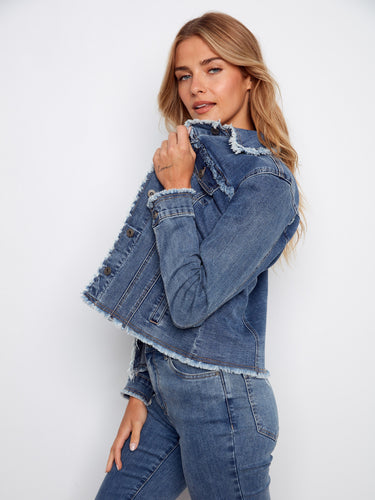 Stretch denim construction ensures a perfect fit in this fashionable frayed edge jacket design. By Charlie B.
