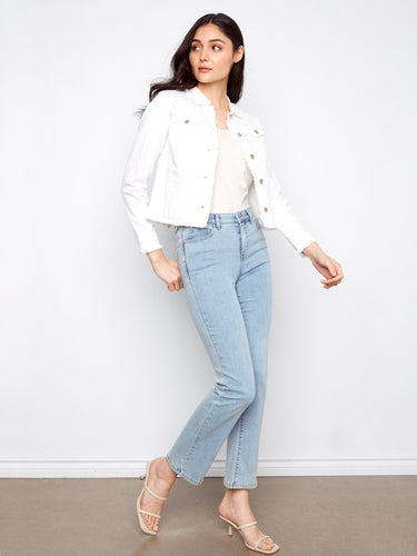 White denim jacket showcases frayed edges for a trendy touch, perfect for casual outings by Charlie B.