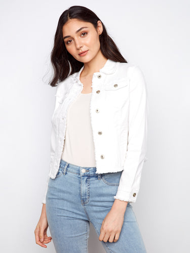 Button closure on this white denim jacket complements its modern aesthetic beautifully by Charlie B.