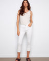 White cropped pants in stretch twill fabric with frayed hem details, offering a regular rise waist by Charlie B.