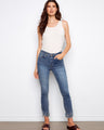 Blue denim pants featuring a skinny fit and stylish frayed hem, crafted from stretch fabric for comfort by Charlie B.