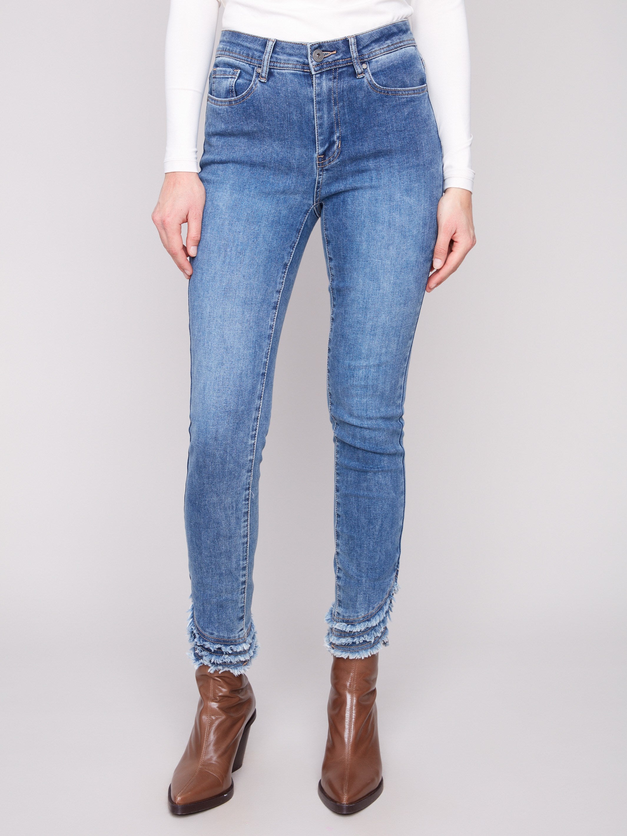 These jeans feature an ankle-length design, perfect for showcasing your favorite footwear by Charlie B.
