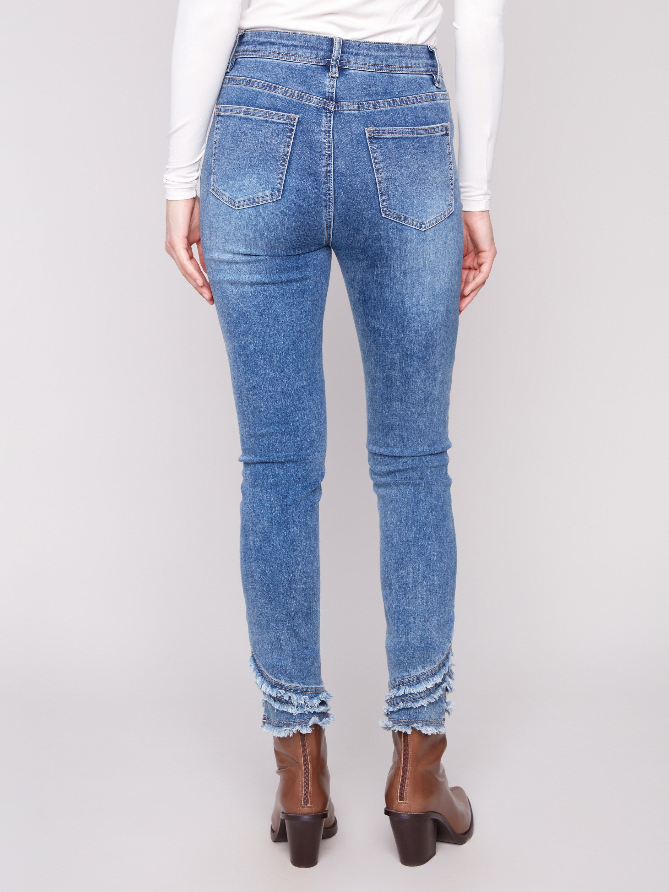 Highlighting a stylish five-pocket design, these pants offer both functionality and flair by Charlie B.