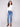 Medium blue denim pants with frayed hem, featuring a skinny leg and regular rise by Charlie B.
