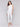 White slim fit twill pants with a frayed hem, ankle-length and mid-rise design by Charlie B.