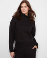 Black French terry top with ribbed mock neck and long sleeves, crafted in a soft cotton blend by Charlie B.