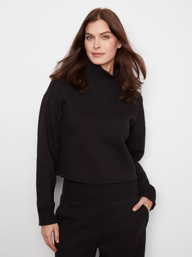 Black French terry top with ribbed mock neck and long sleeves, crafted in a soft cotton blend by Charlie B.