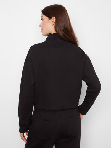 Stylish black mock neck top with long sleeves, made from a comfortable cotton blend fabric by Charlie B.